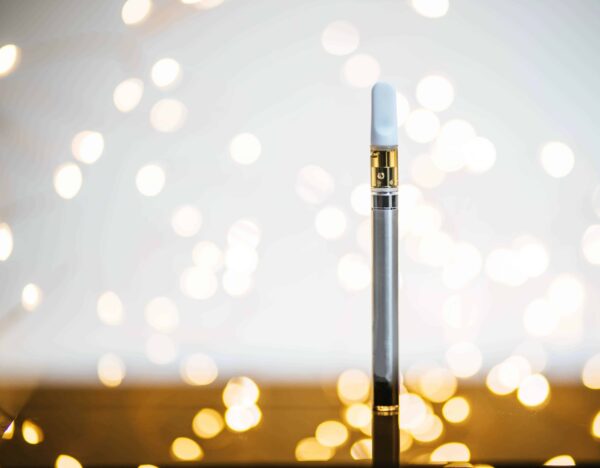 Purple Leaf - Distillate Vape Pen with Bokeh Background- Feature Image