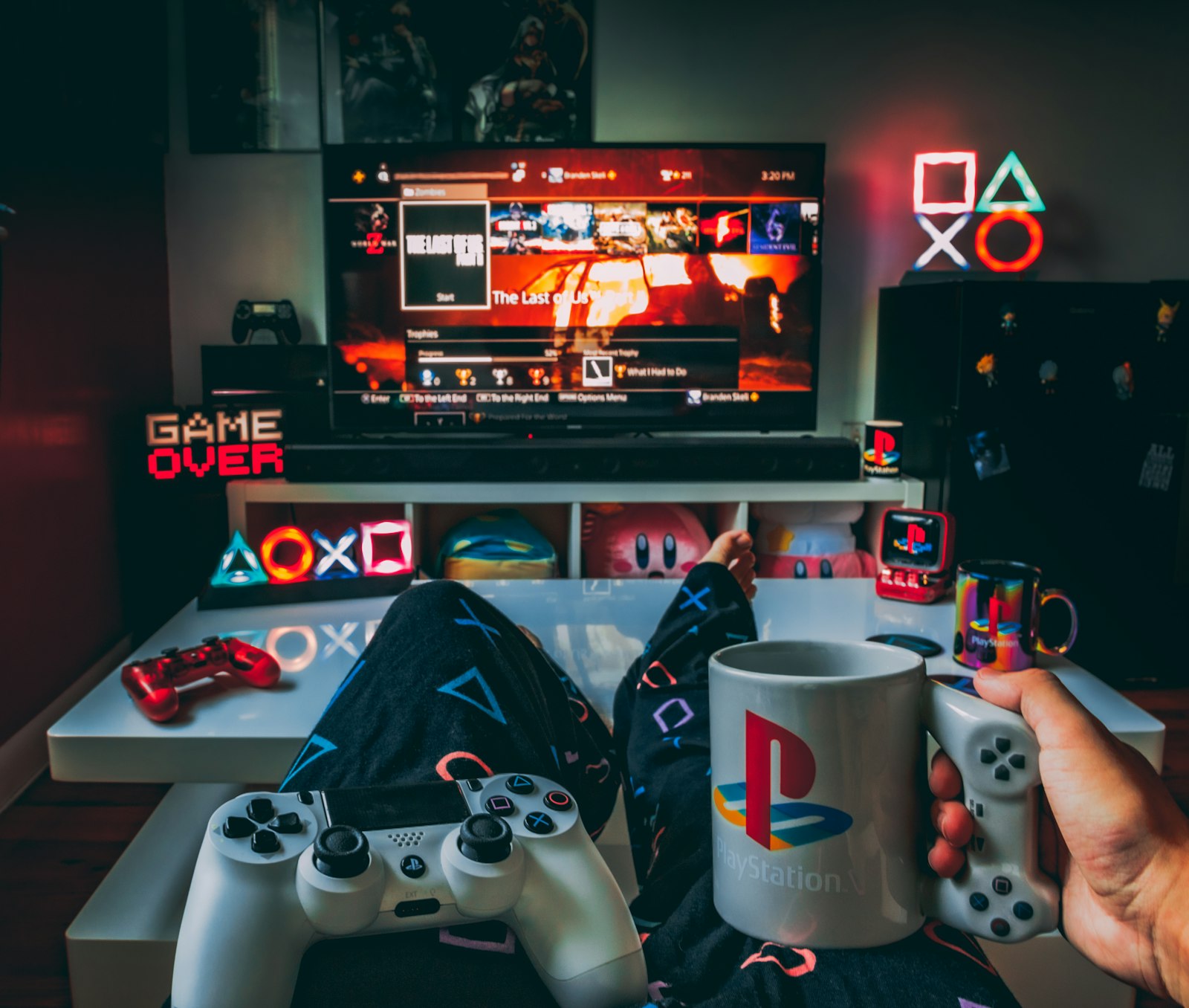 Person holding a game controller in front of a TV, for a guide to the best video games to play when high