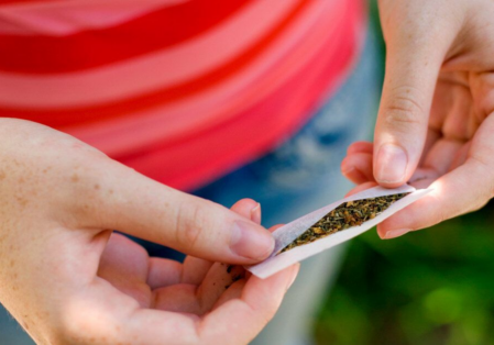 Girl_holding_marijuana-1200x628-facebook-1200x628